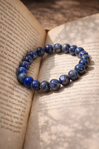 Lapis Lazuli bracelet displayed on an old book