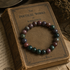 Close up shot of Blood Stone Bracelet on an old book