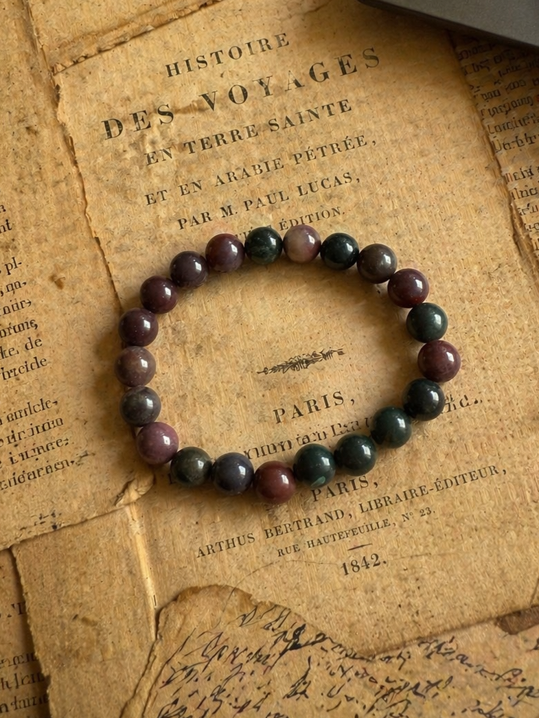 Bloodstone Bracelet displayed on a book